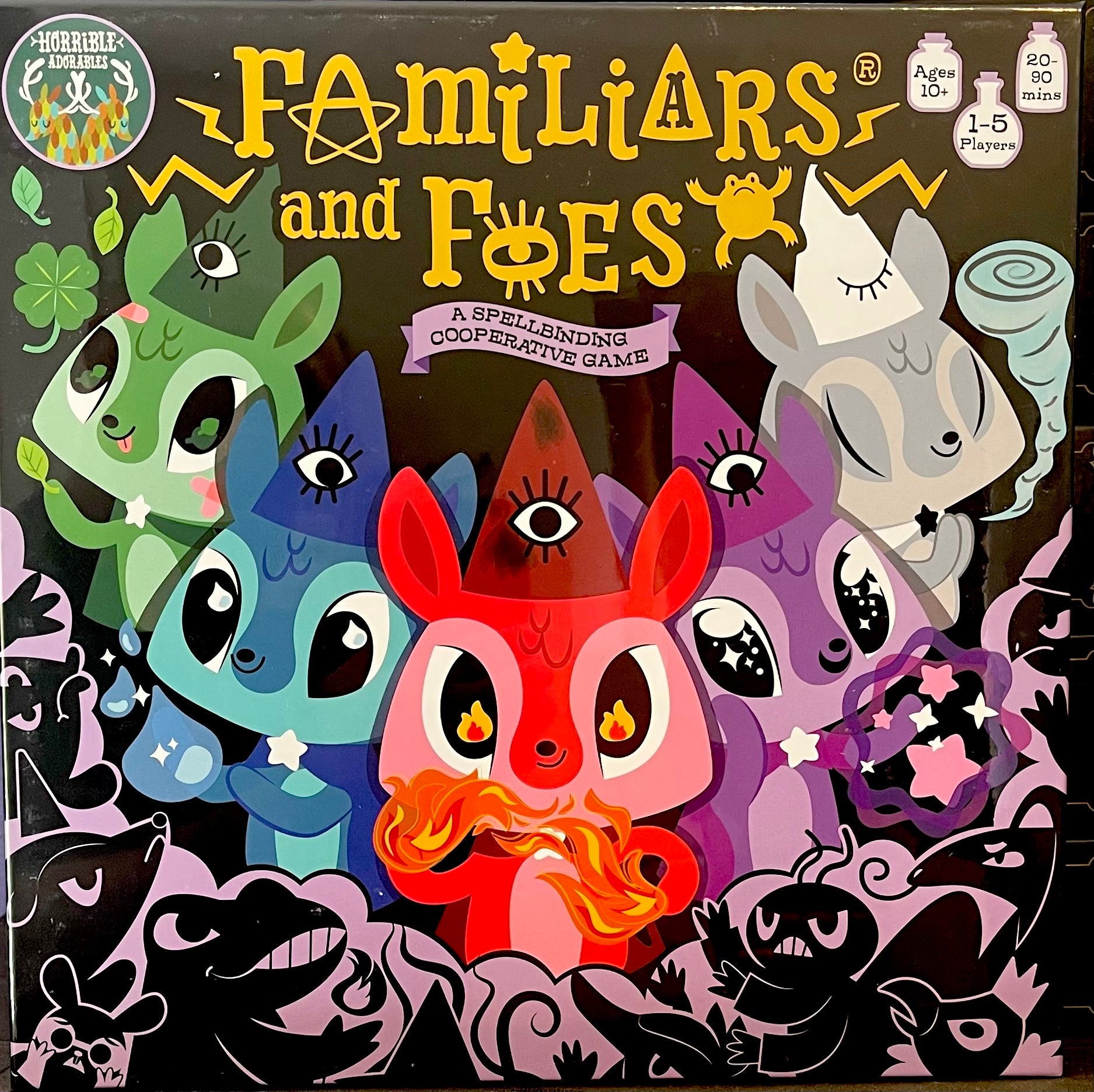 Board game box for 'Familiars and Foes' with colorful characters on a dark background